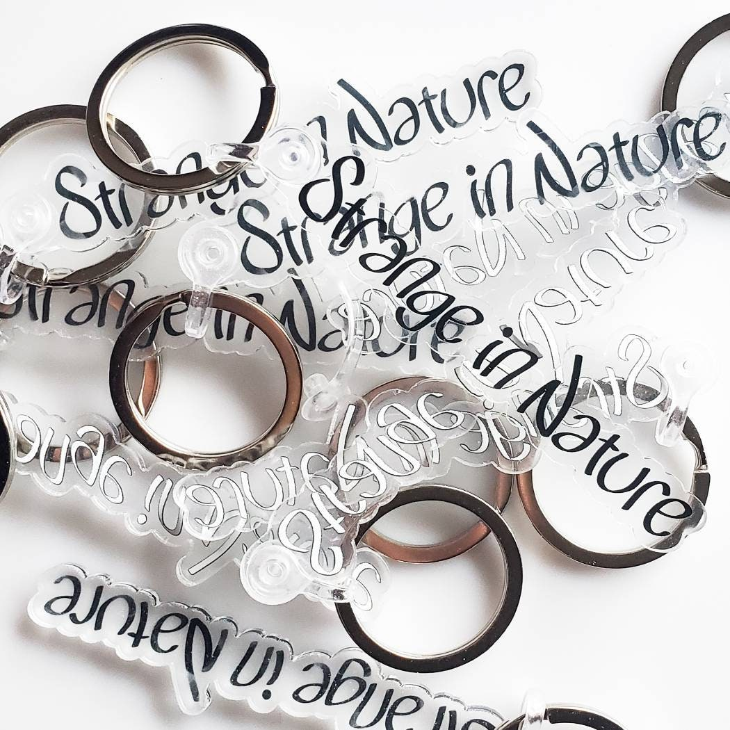 A bundle of acrylic Strange in Nature Keychains