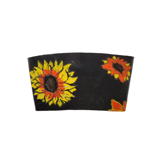 A leather coffee sleeve with Sunflowers painted on it